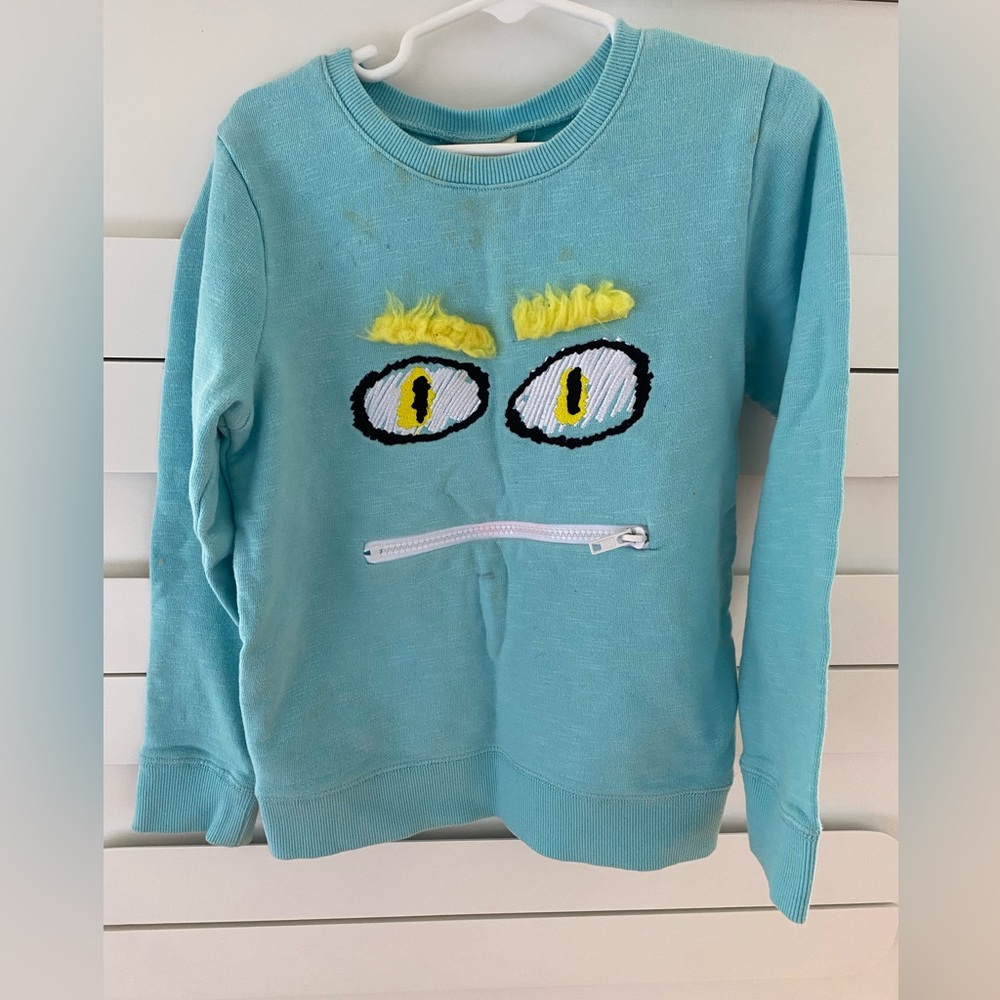 Monster sweatshirt, blue with fun zipper detail.